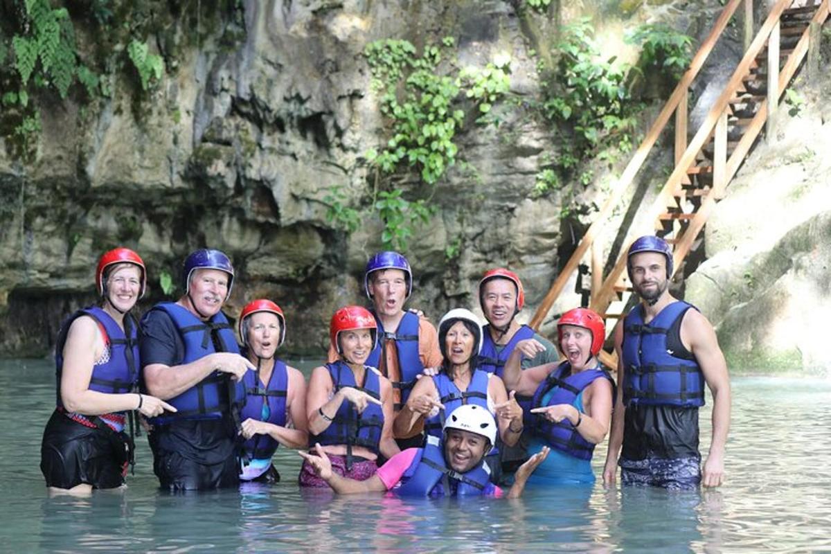a group of people posing for a picture in the water