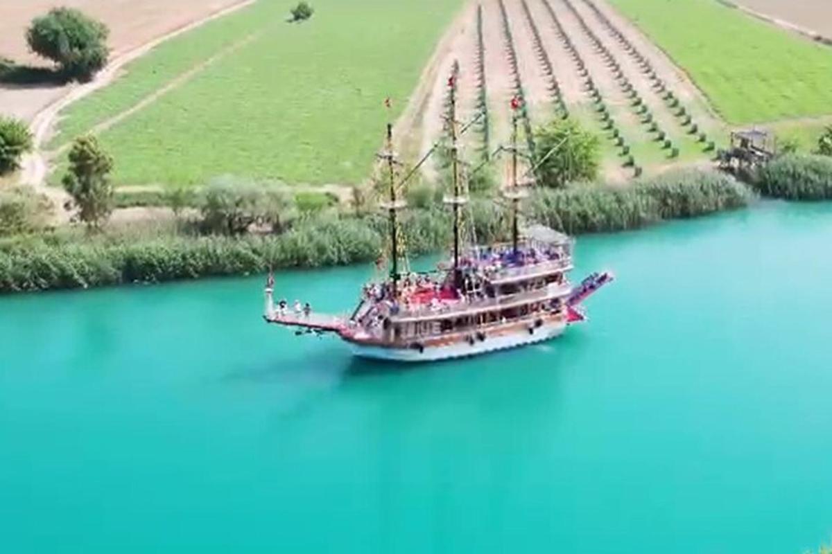 a large boat in the middle of a river