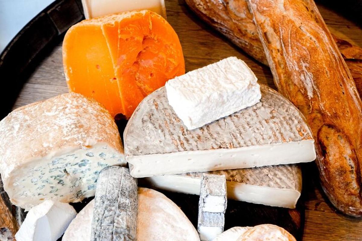 a group of different types of cheese and bread