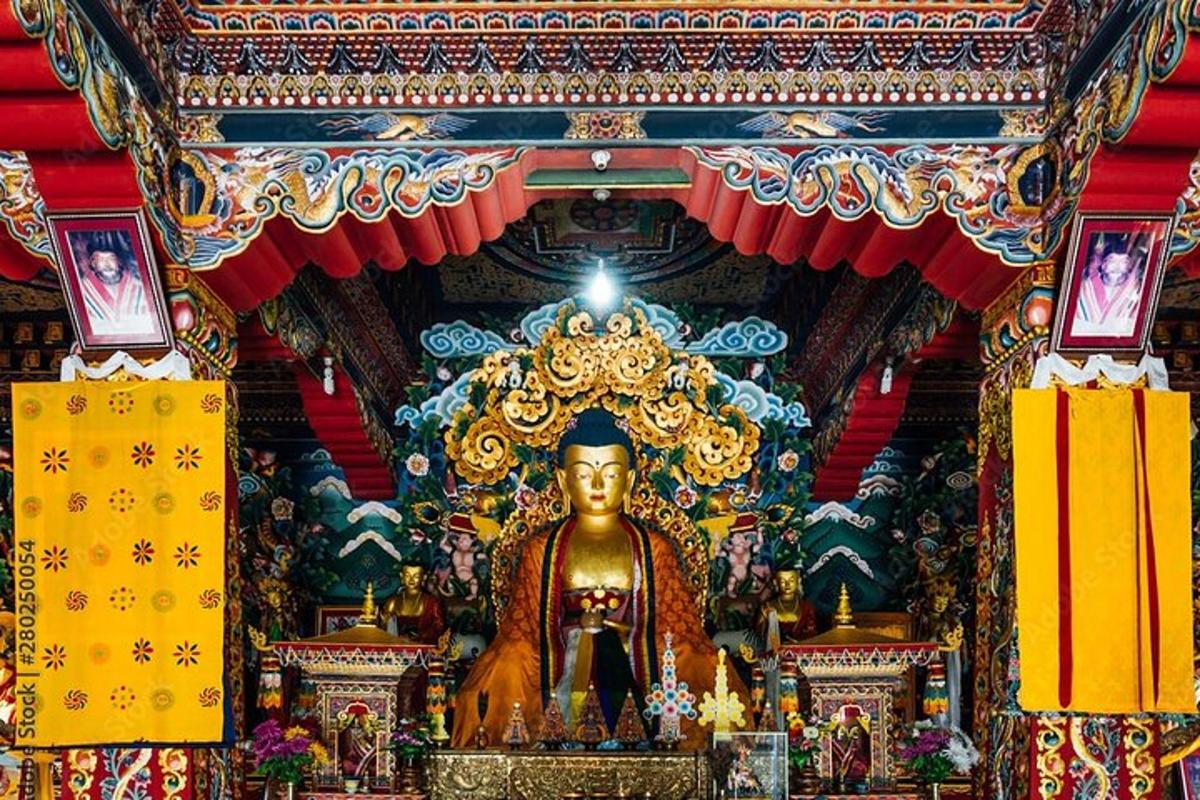 a temple with a large golden statue in the middle