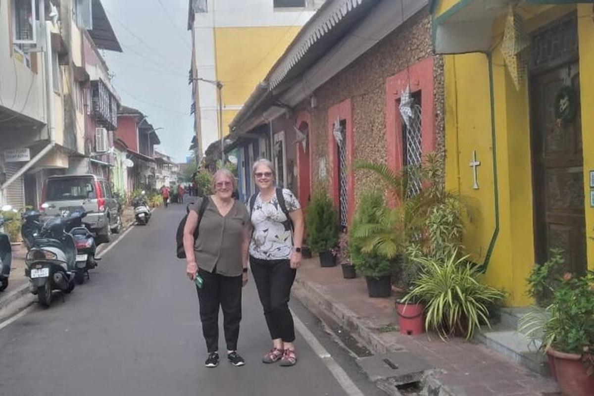 two women are standing on a city street