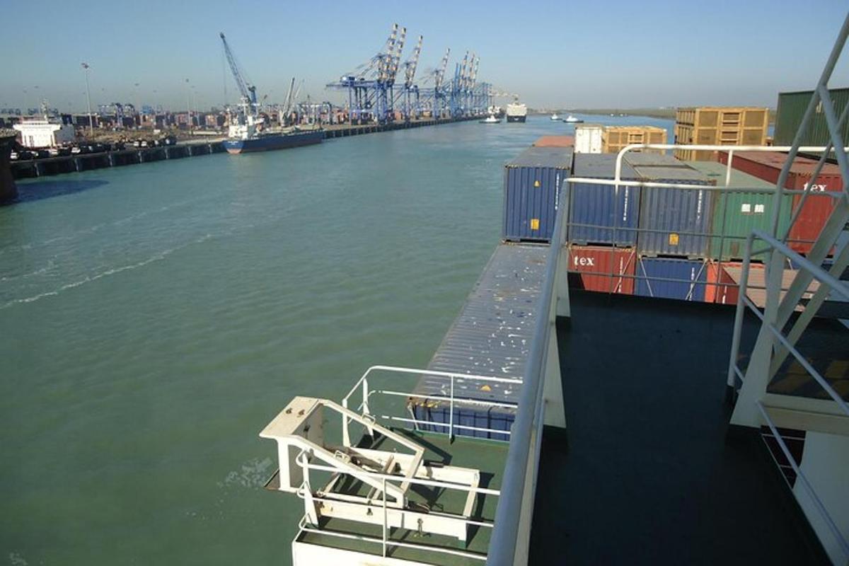 a boat is docked at a dock in the water