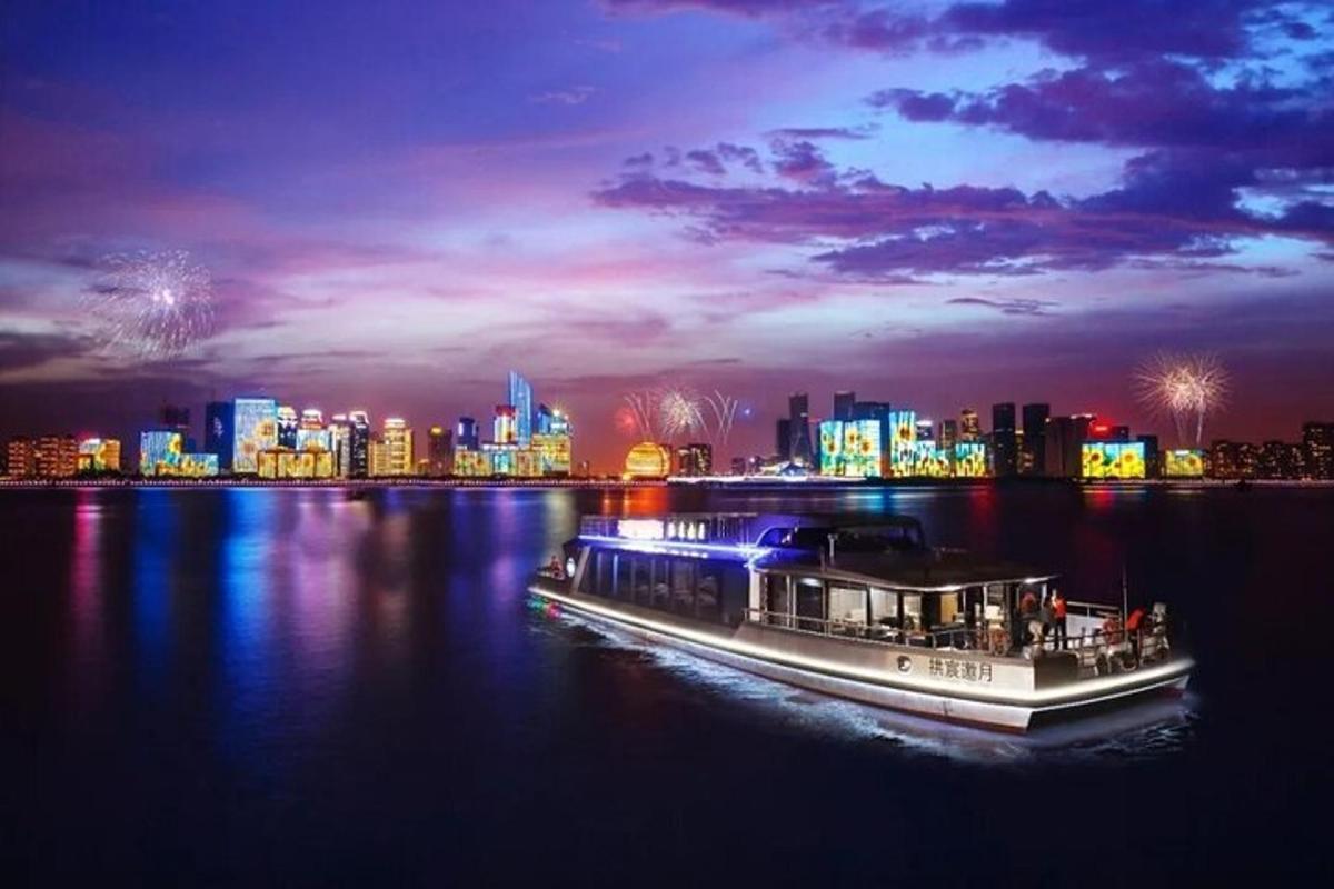 a boat on the water with a city in the background
