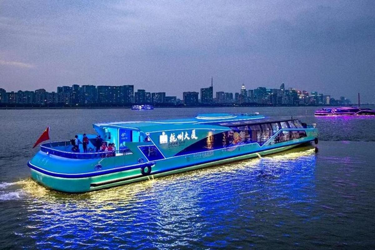 a blue boat in the water with people on it