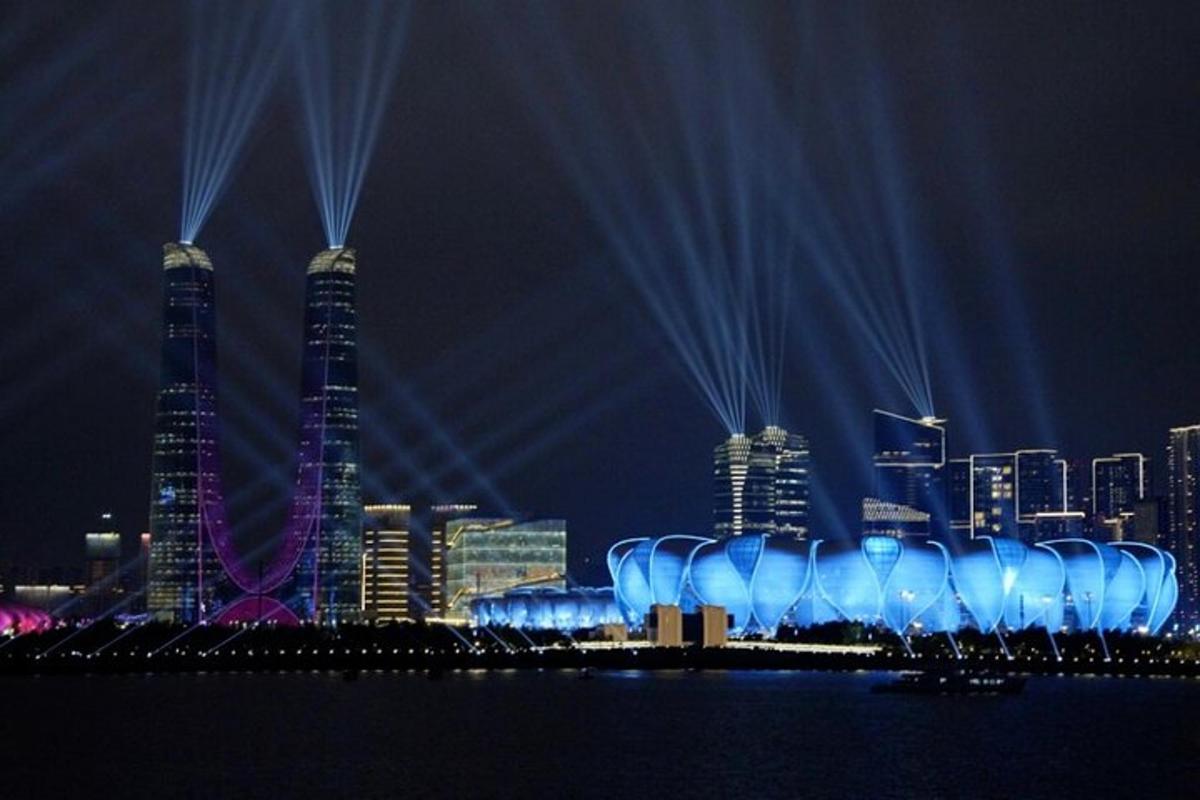a view of a city at night with blue lights
