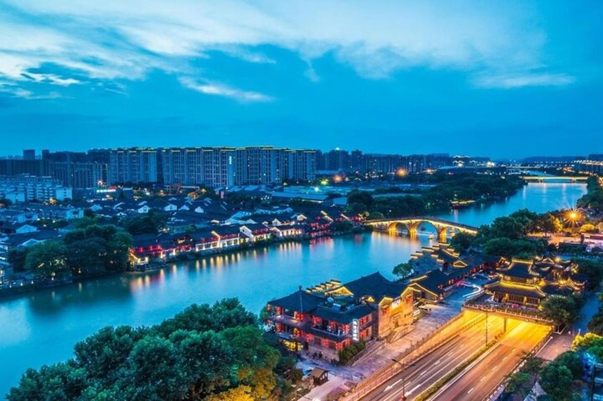 a view of a city with a river at night