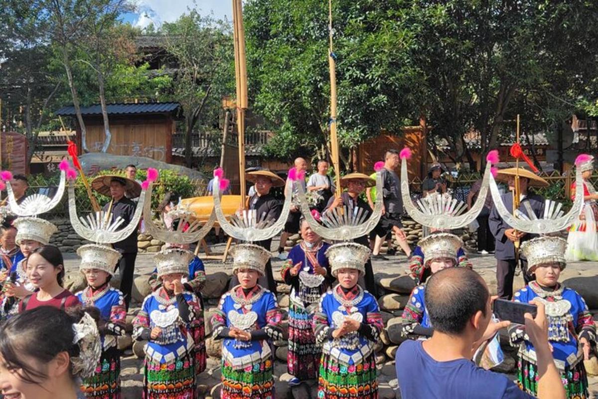 a group of people dressed in traditional clothing posing for a picture