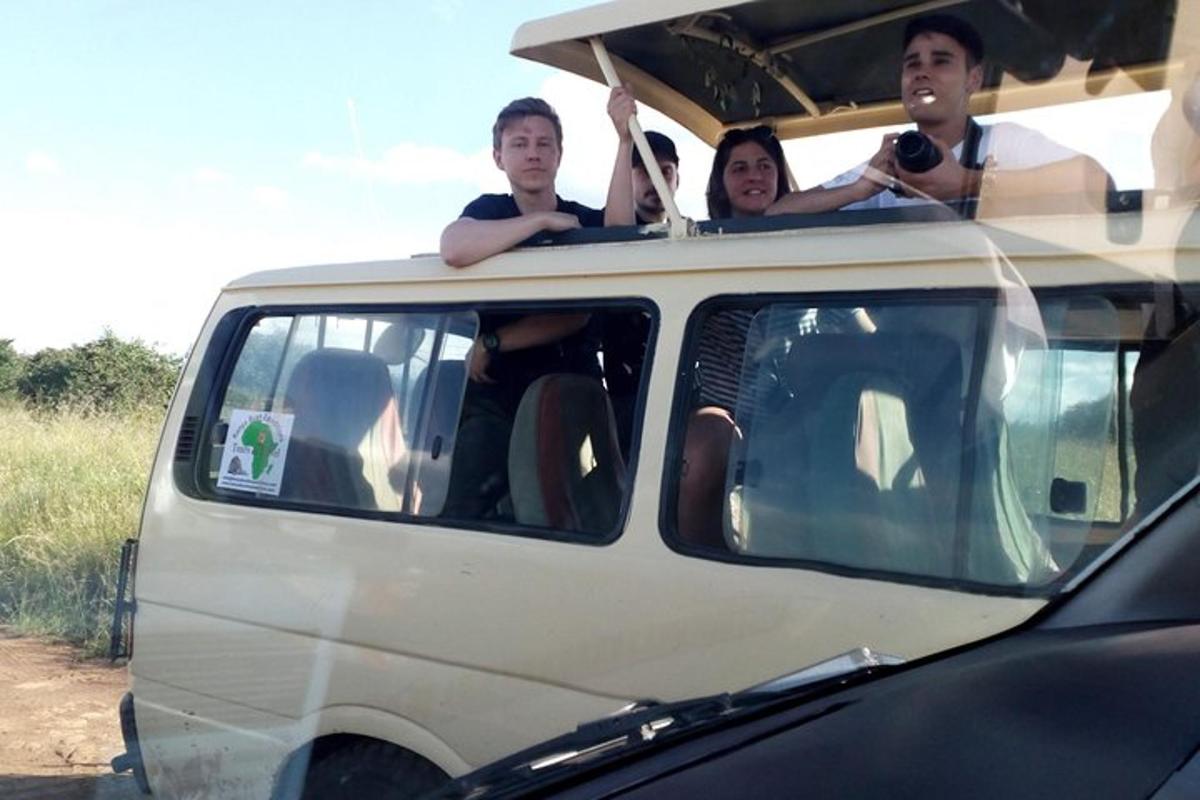 a group of people sitting in the back of a van
