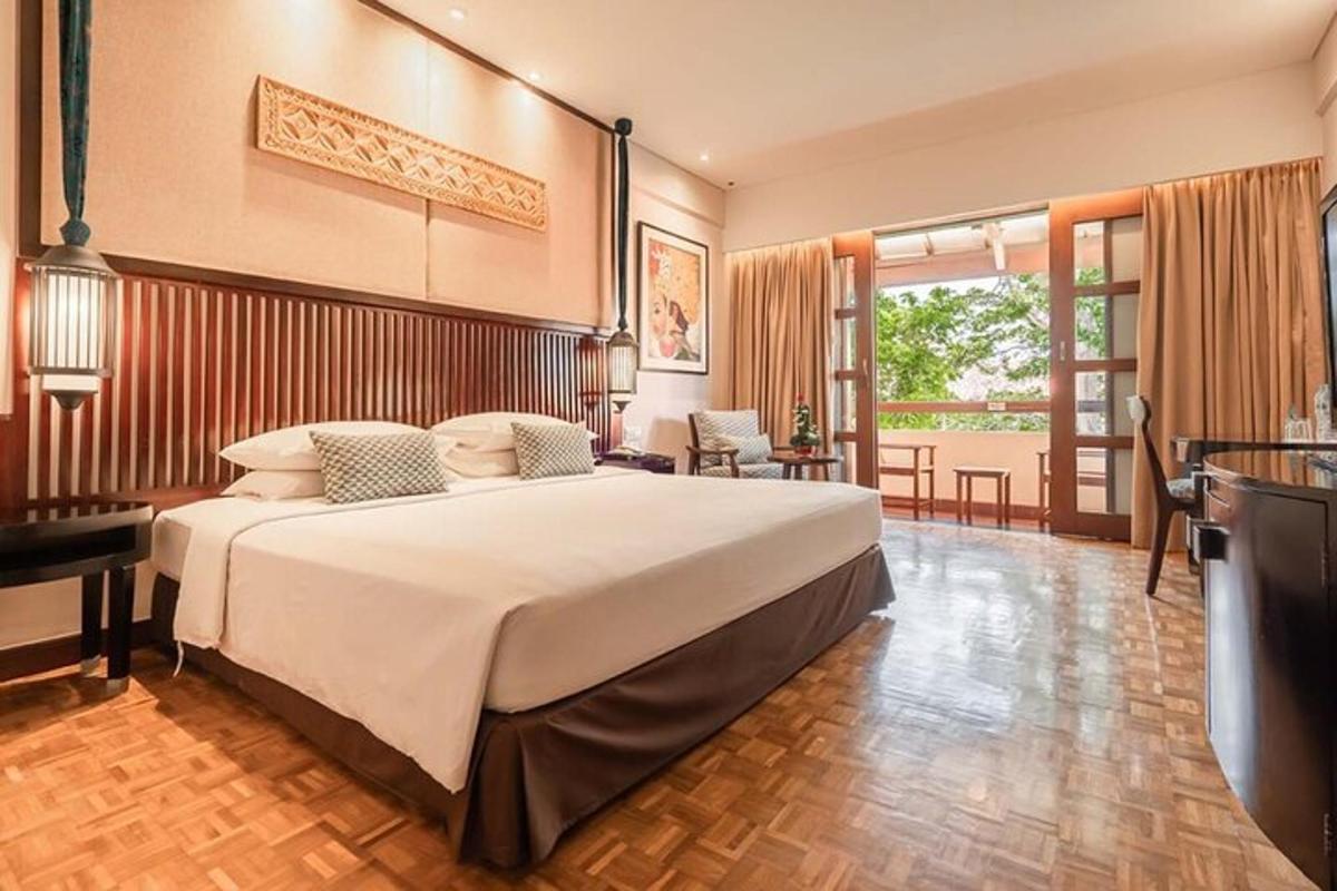a large bedroom with a large bed in a room