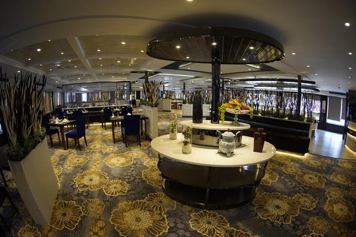 a restaurant on a cruise ship with tables and chairs