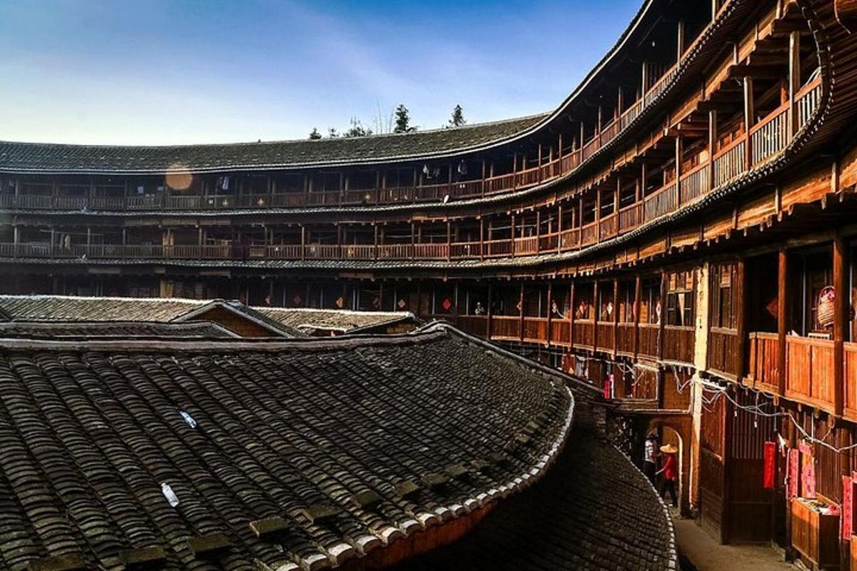 an old building with a large roof in the middle