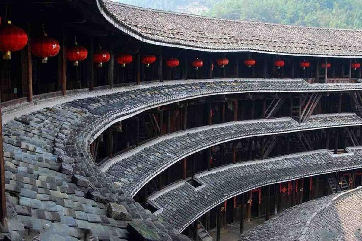 a stone stairway in a building with red lanterns