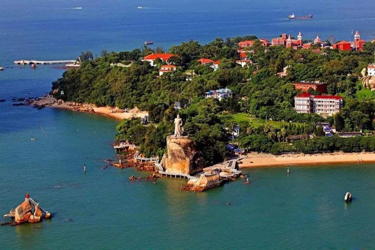 an island in the water next to a beach