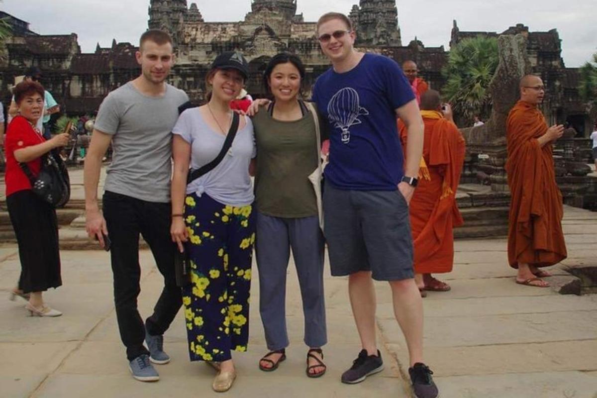 a group of people standing in front of a temple