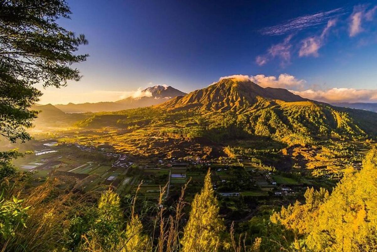 a view of a mountain with a town and a city
