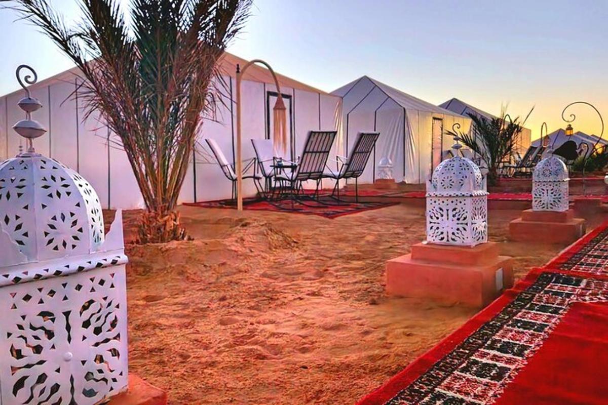 a group of chairs and a building in the desert