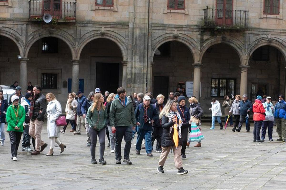a crowd of people walking in front of a building