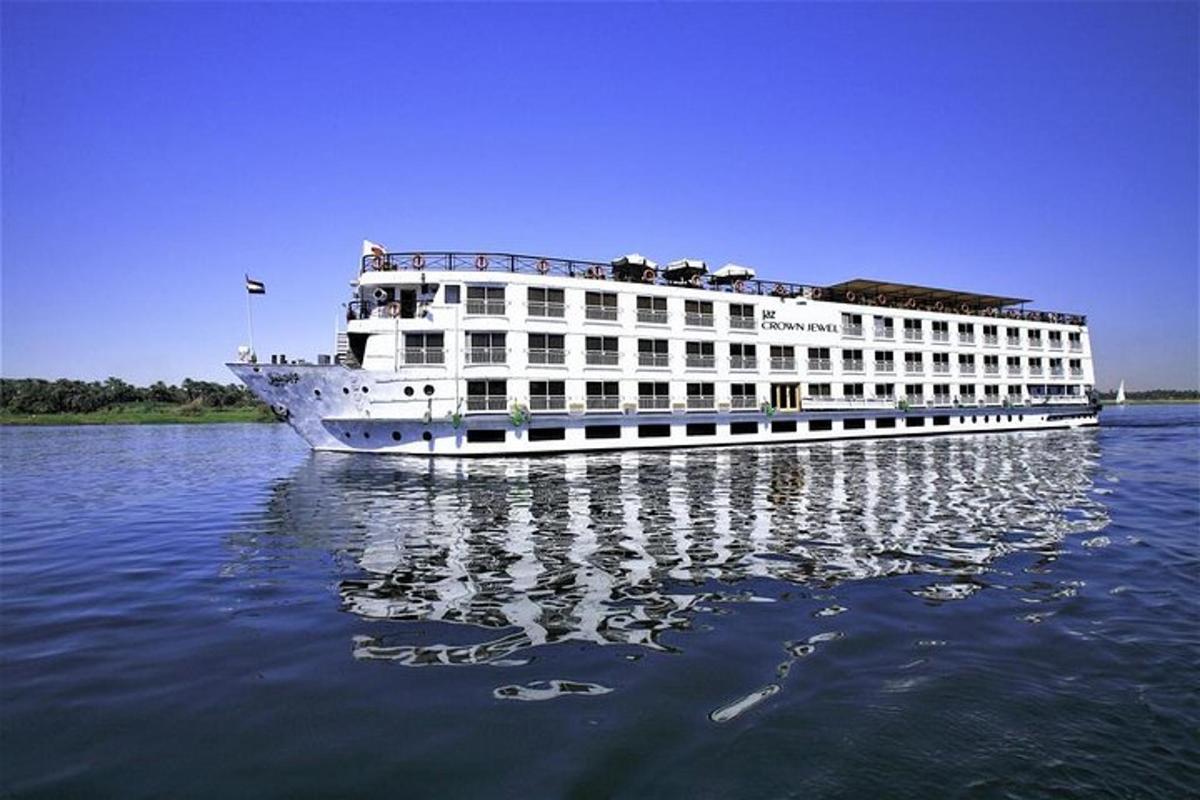 a large white cruise ship on the water