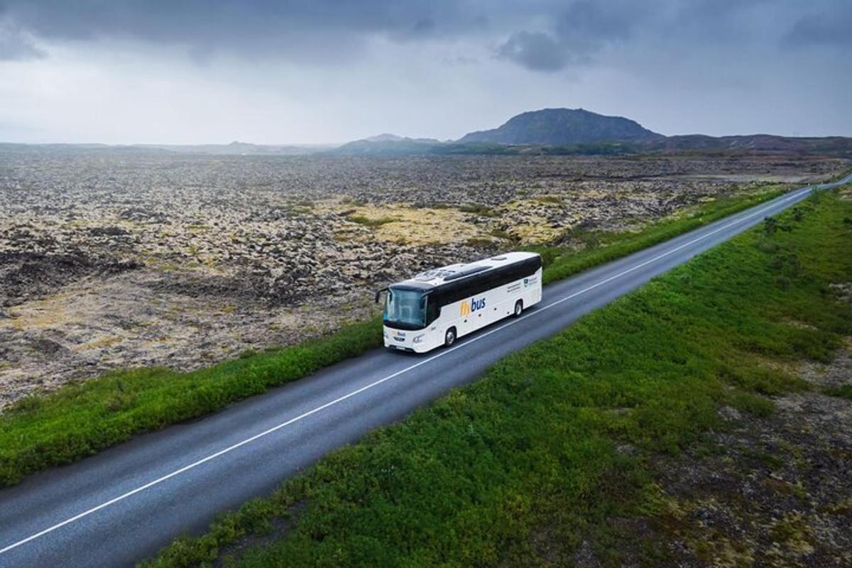 a bus driving down a road in the desert