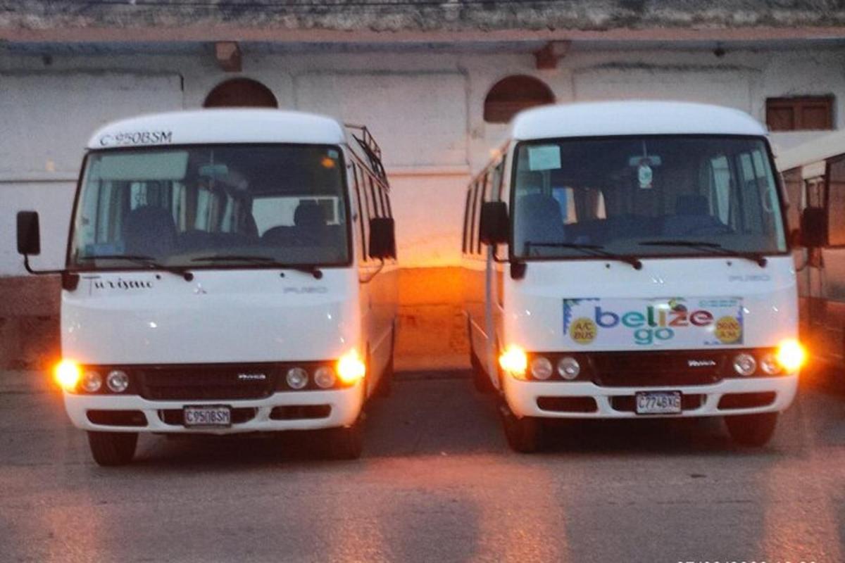two white trucks parked next to each other