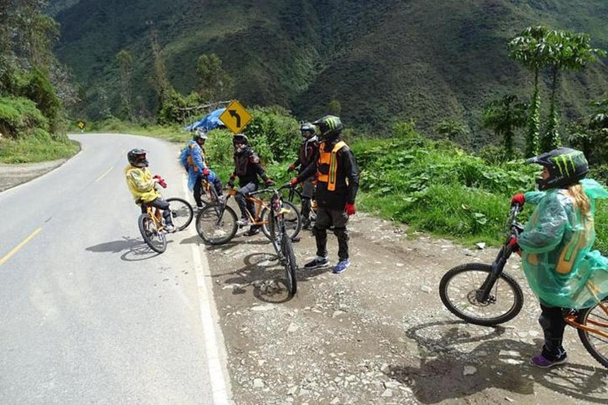 a group of people on bikes on a road