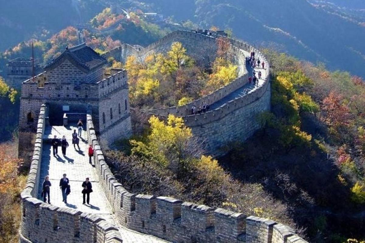a group of people walking on the great wall