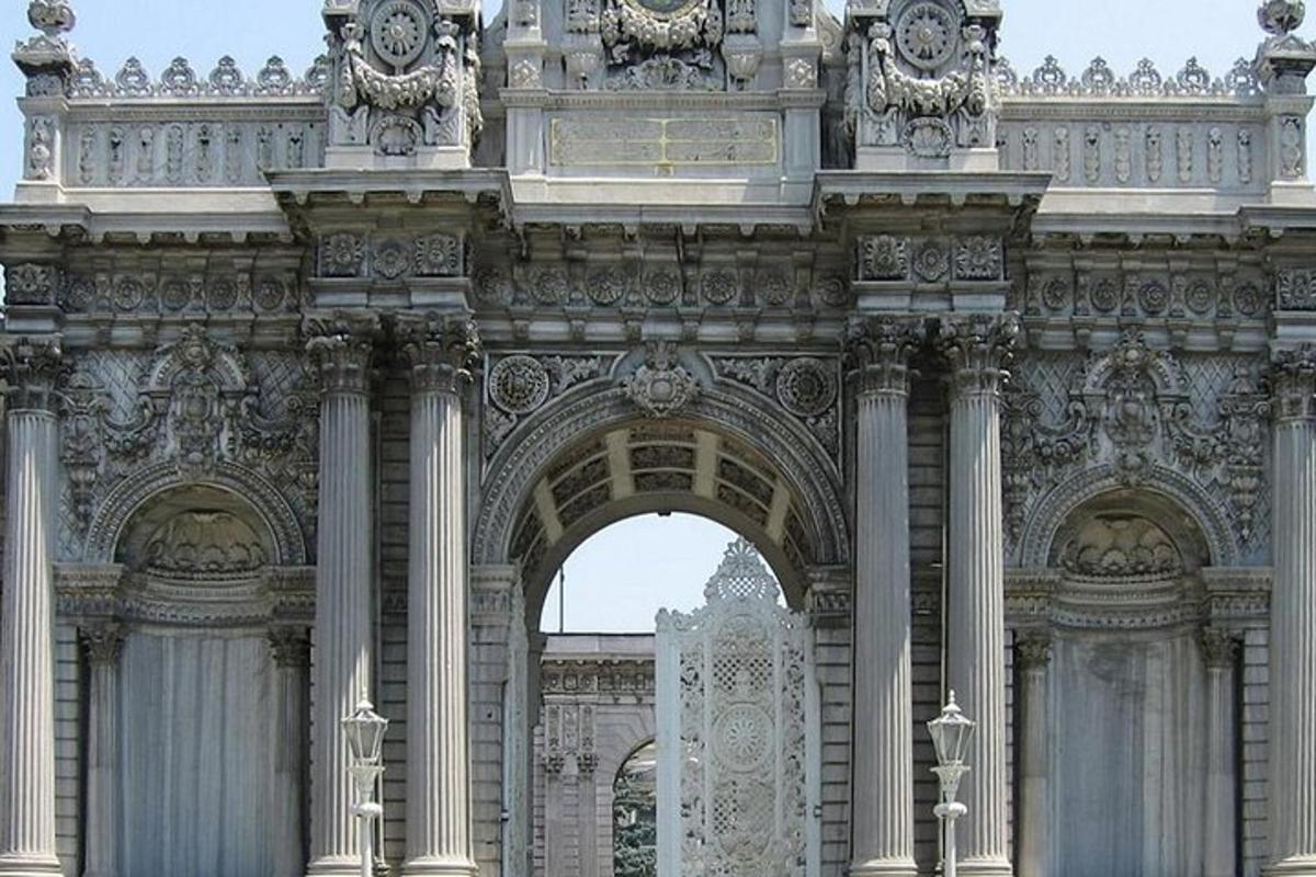 a building with an arch with two clocks on top