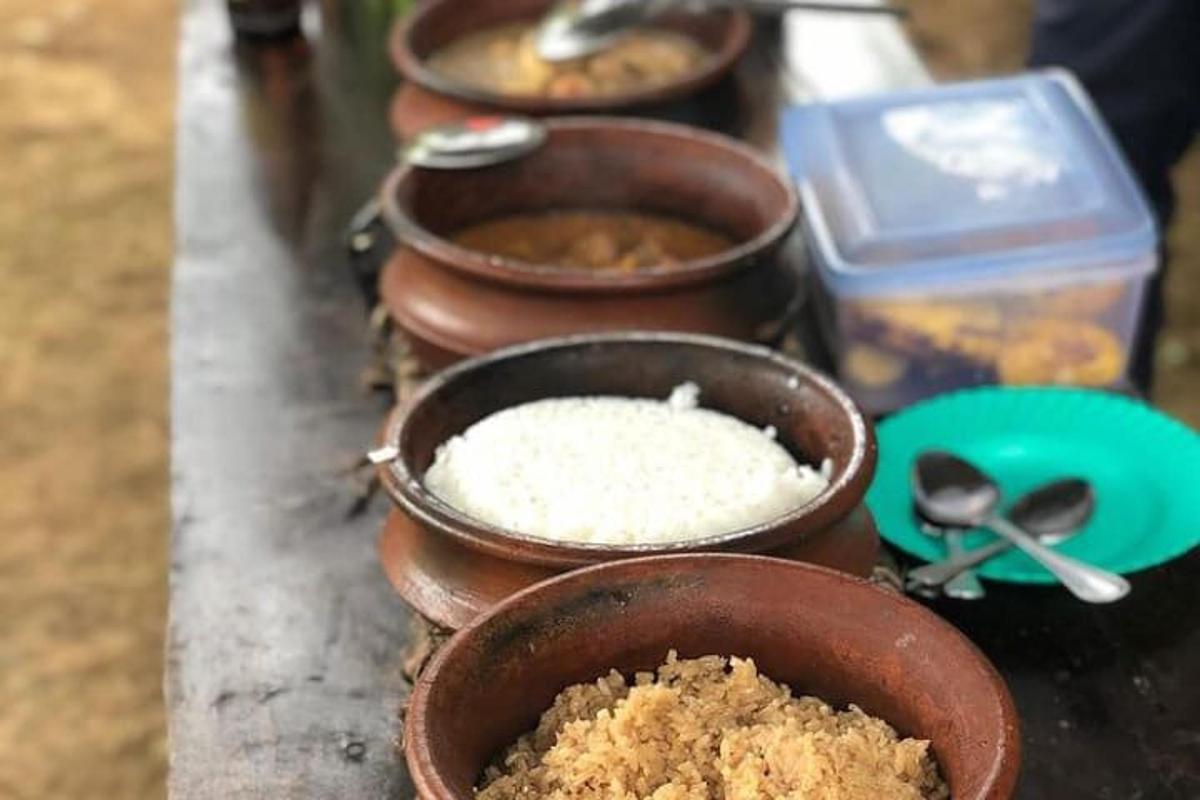 a row of bowls of rice on a table