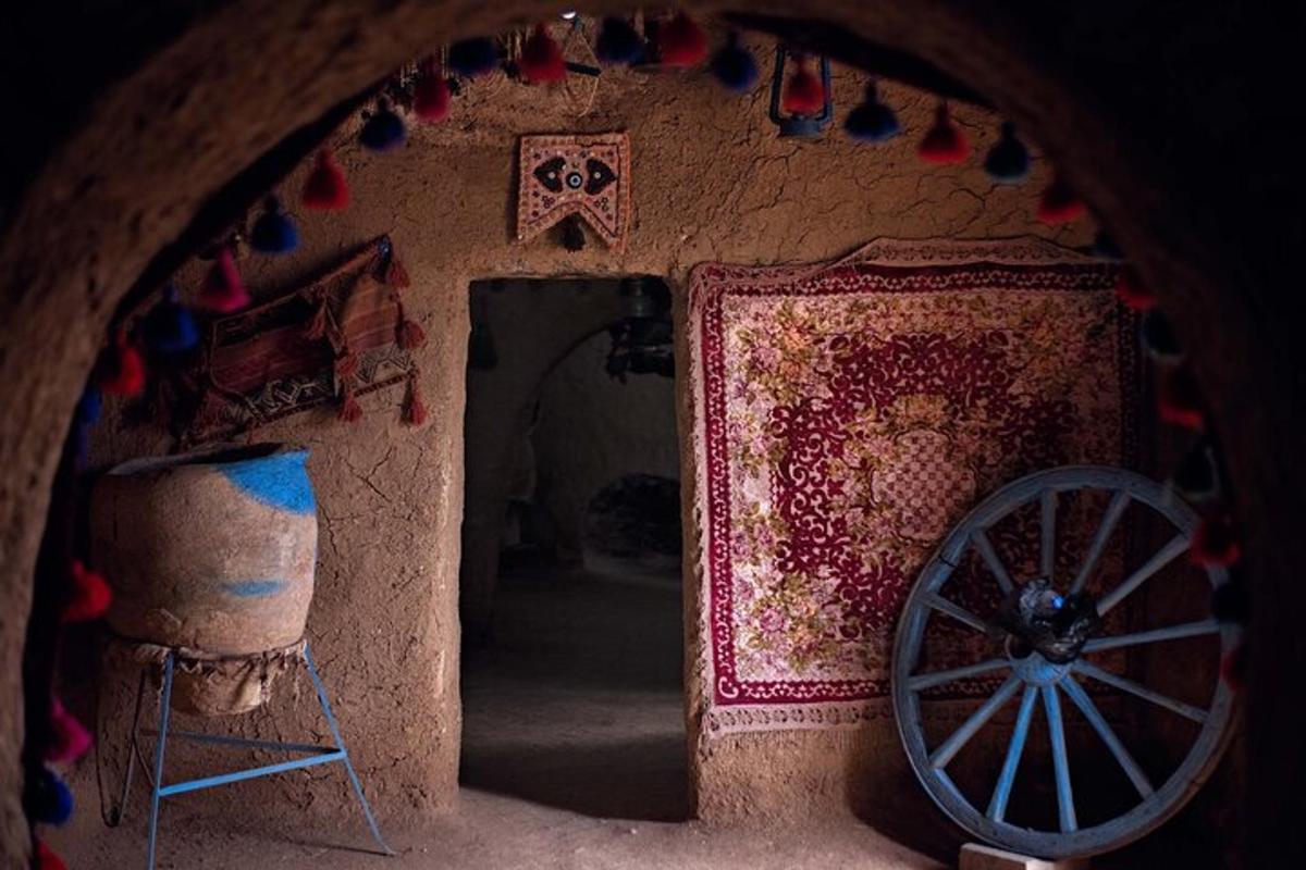 a room with a wooden wheel and a room with a wall