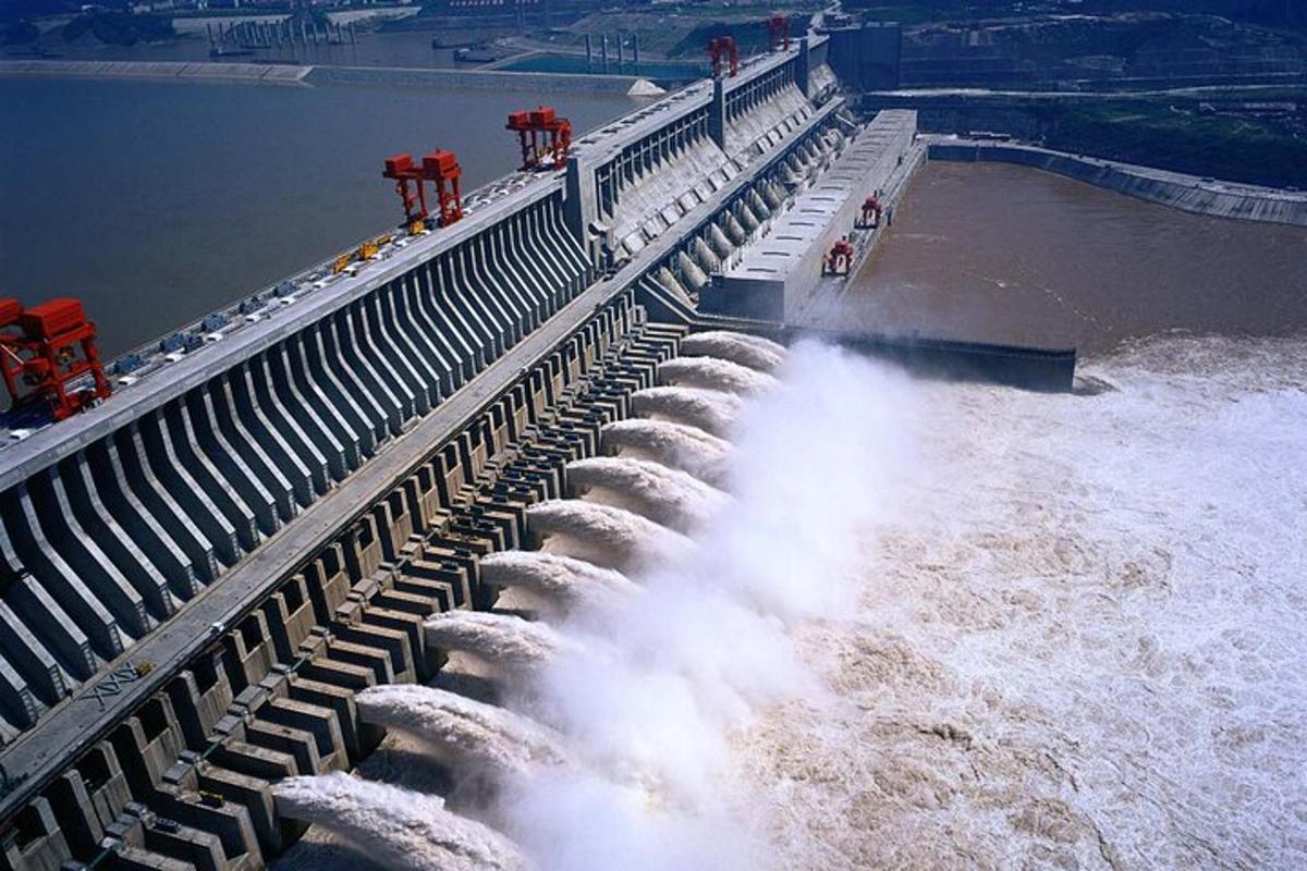 a dam with water shooting out of the water