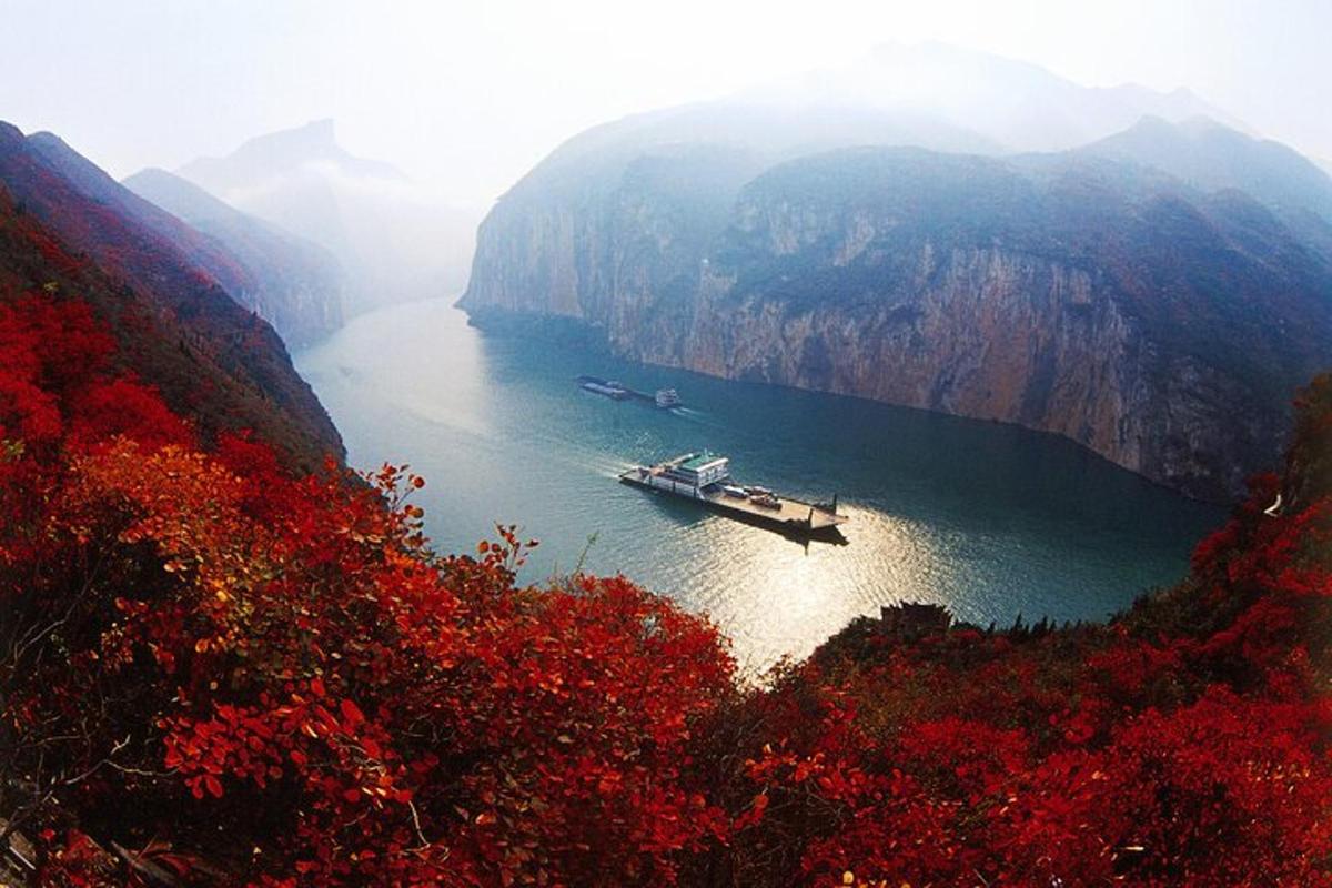 a boat on a river in a canyon