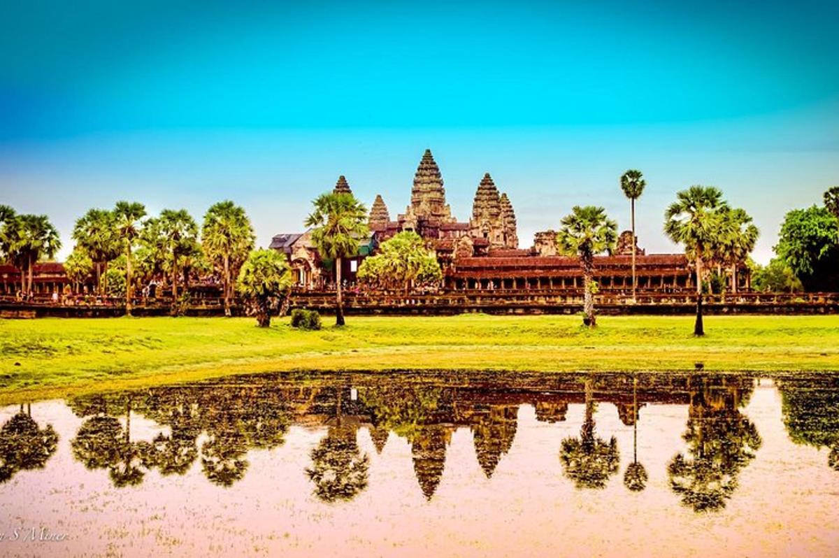 a view of a temple with its reflection in a body of water