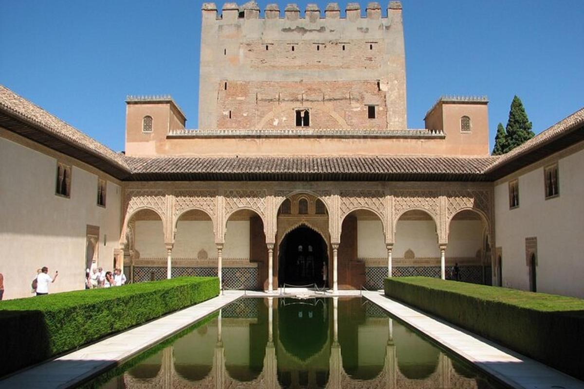 a building with a pool of water in front of a building