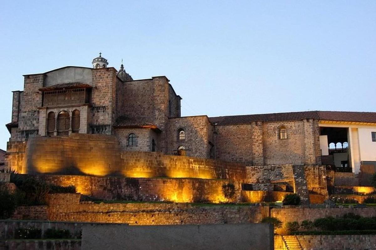 an old building on top of a stone wall