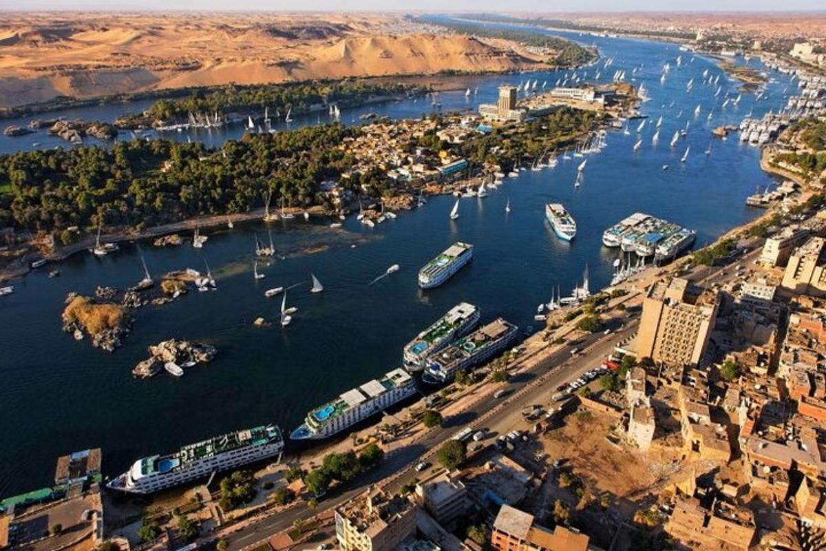 an aerial view of a river with boats docked