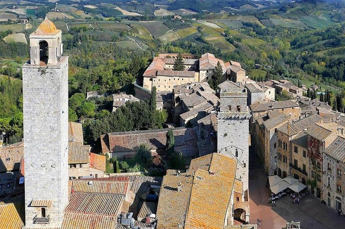an aerial view of a town with a clock tower