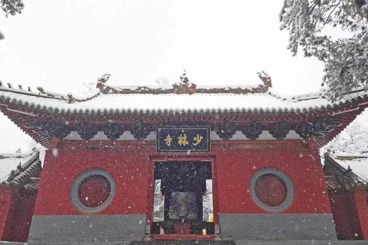 a red building with snow on top of it