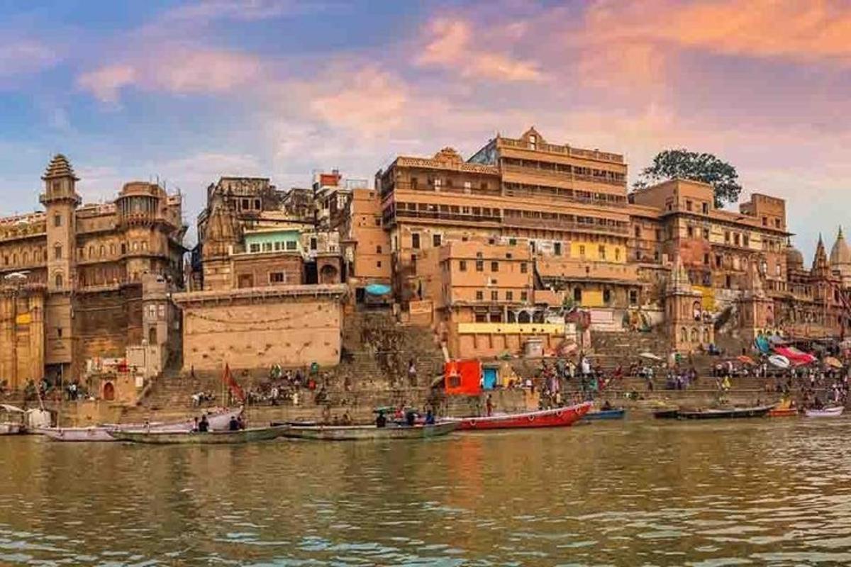 a group of buildings next to a body of water