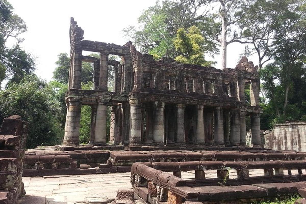 a large stone building with trees in the background