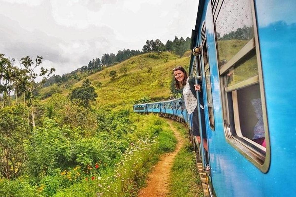 a woman is looking out the window of a train