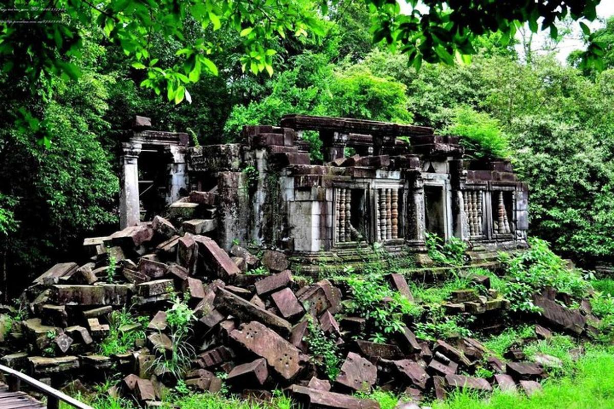 an old building sitting in a pile of rubble