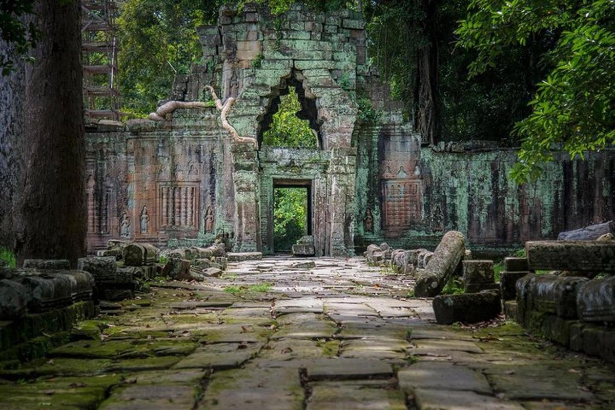 an old building with a doorway and a stone path