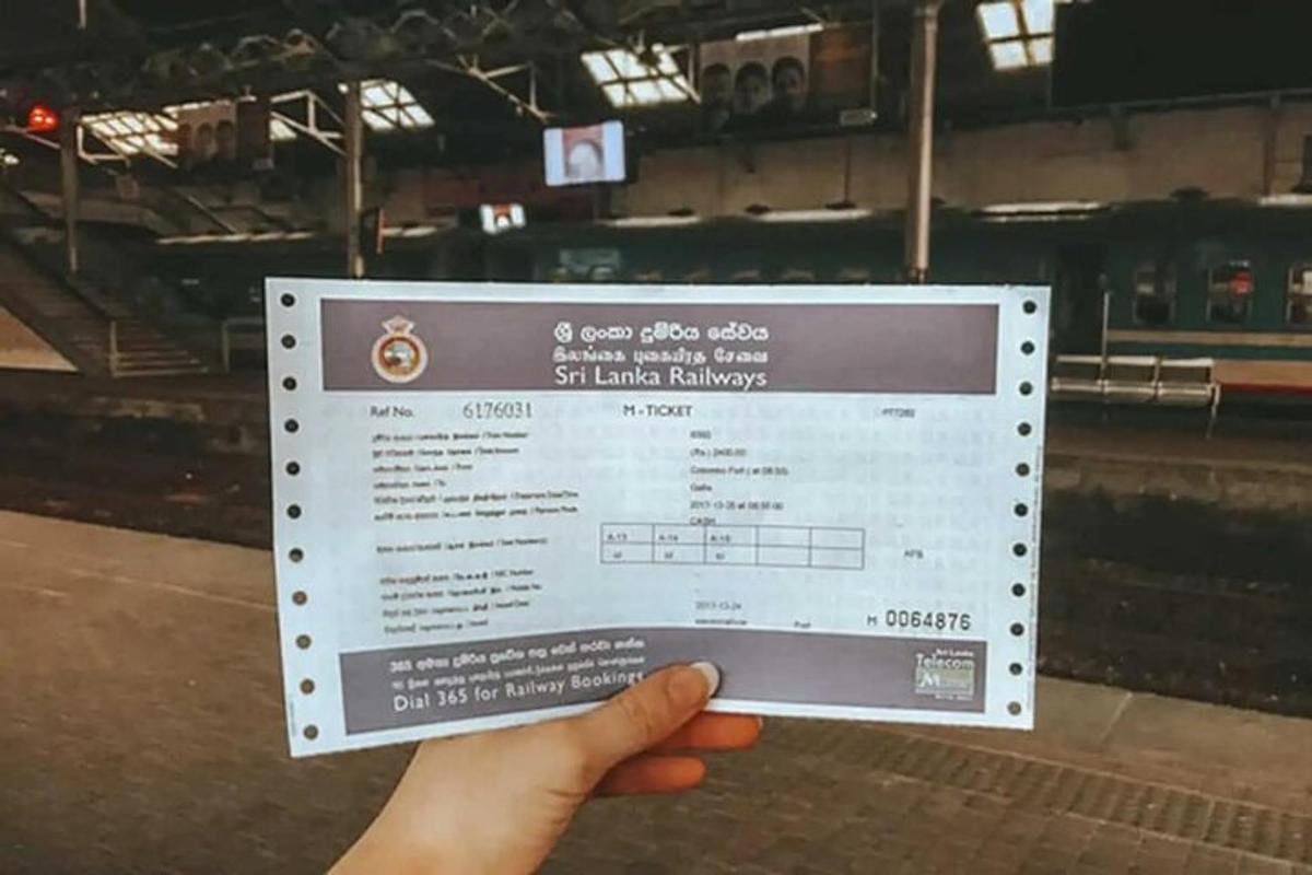 a person holding a sign in a train station