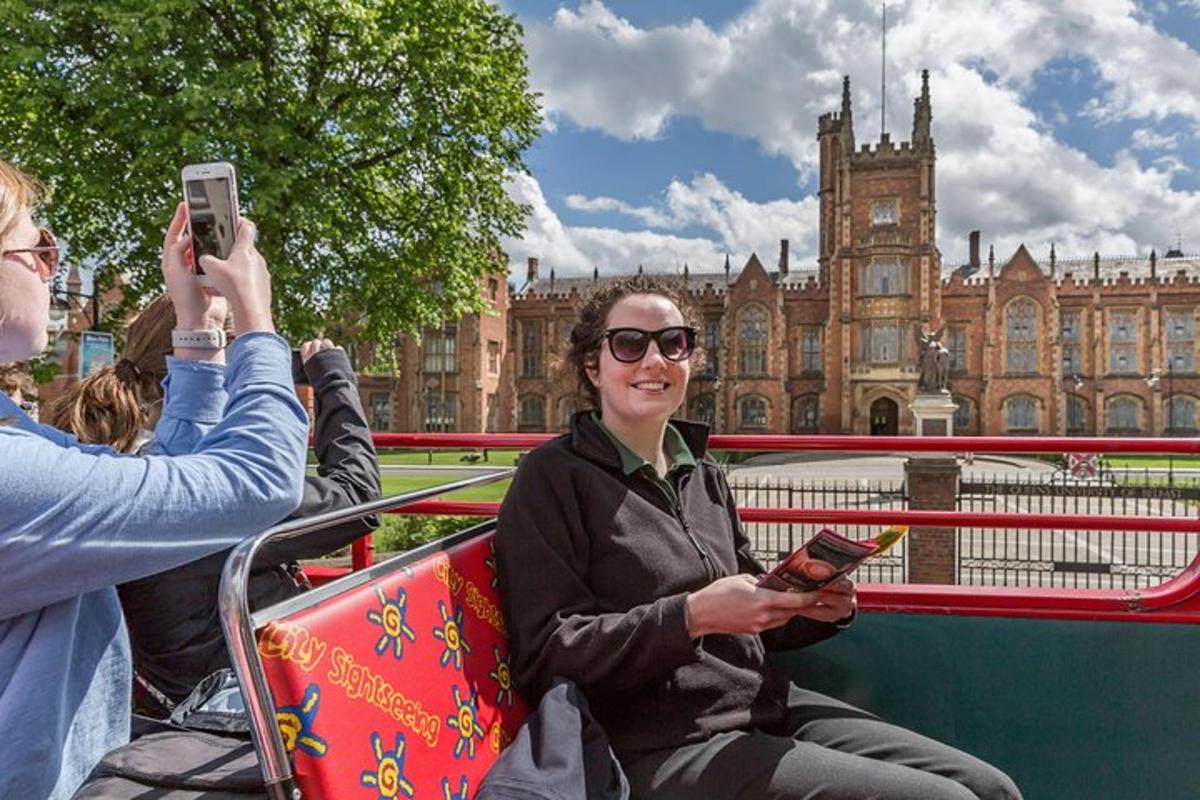 a woman taking a picture of herself on a bus