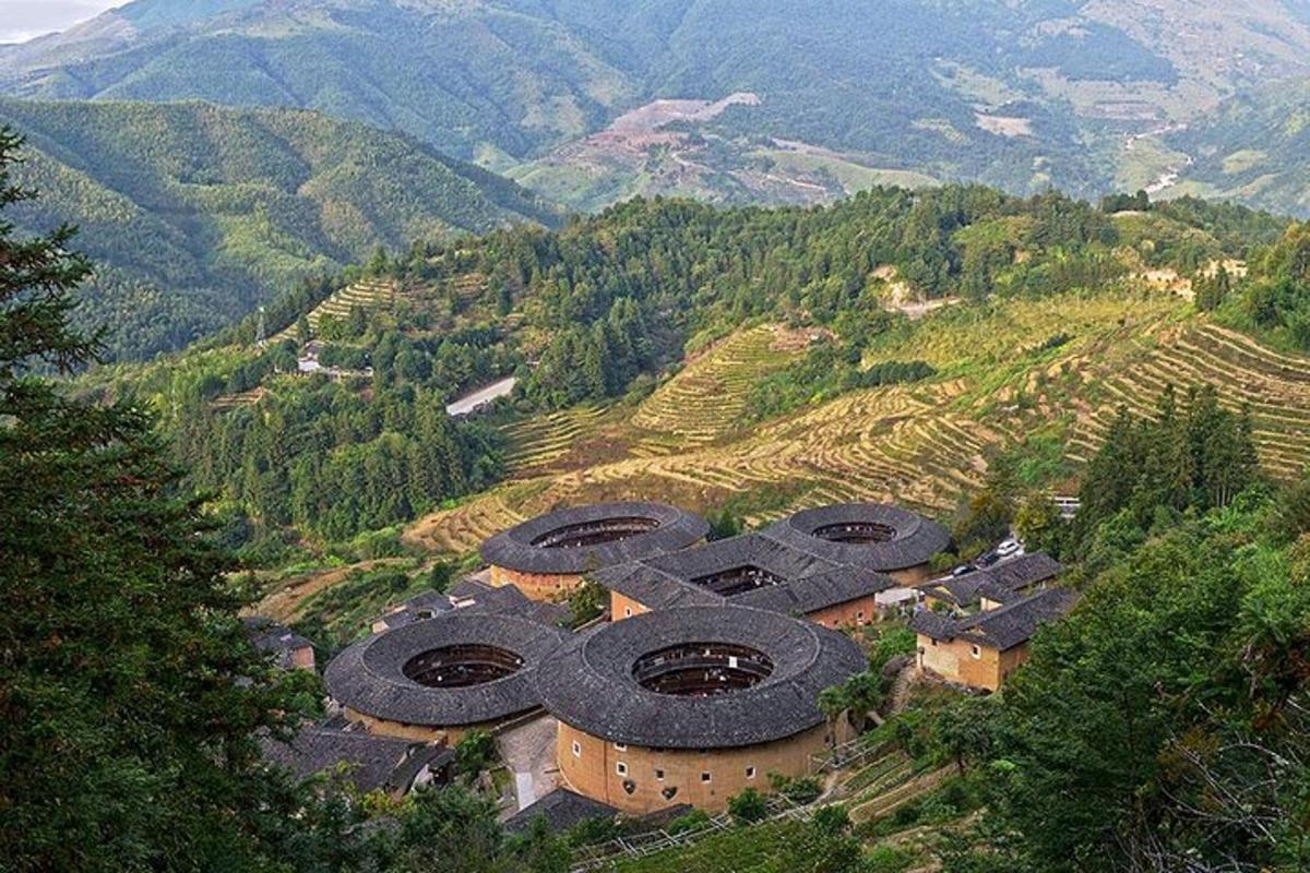 an aerial view of a building on a mountain