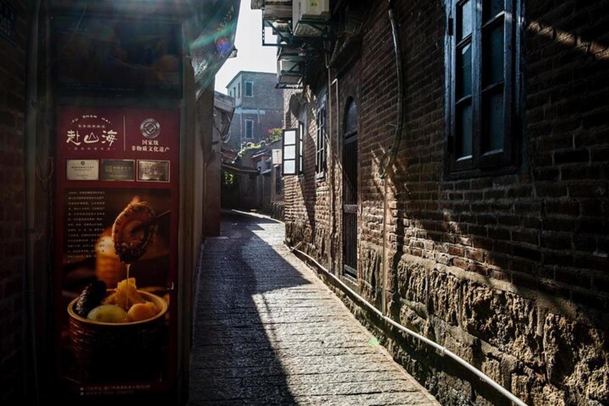 an alley with a vending machine with fruit in it