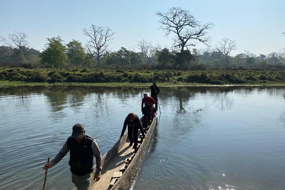 a group of people in a boat in the water