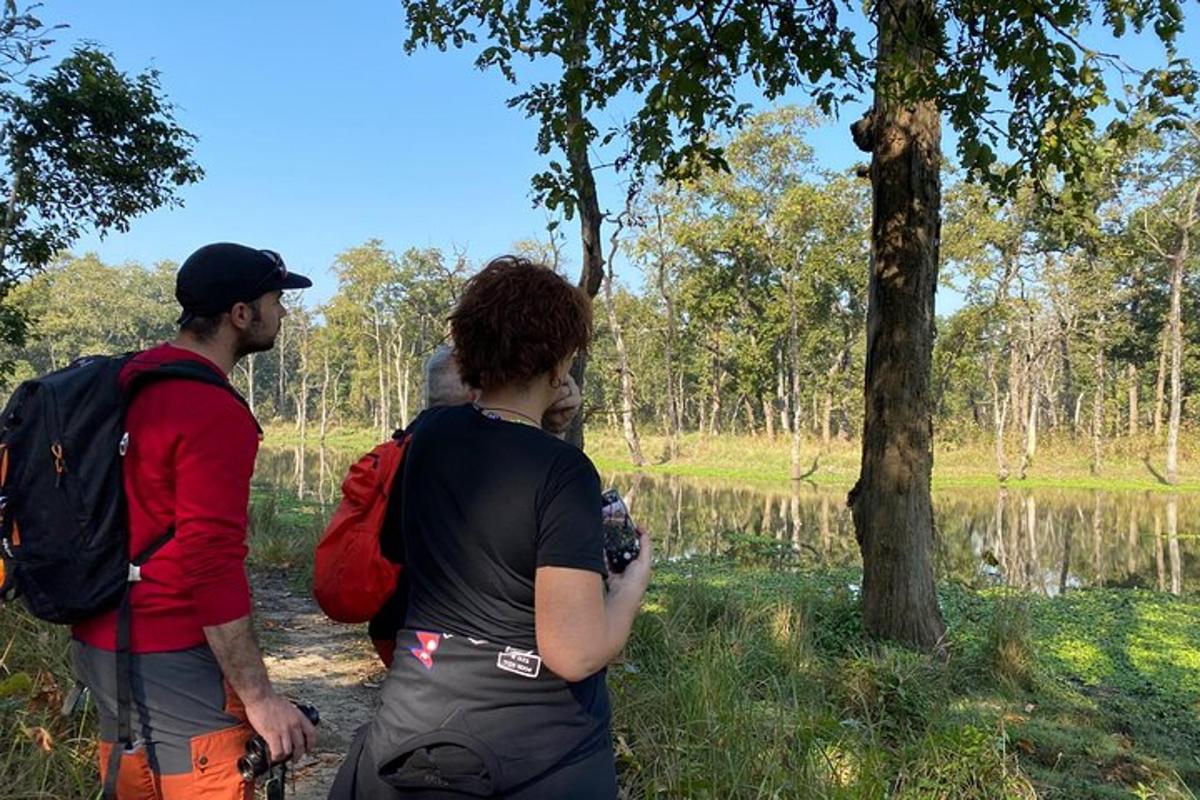 a group of people standing next to a tree