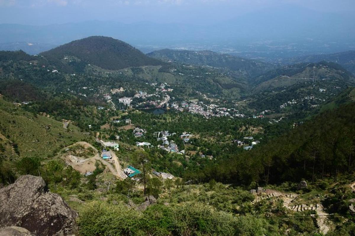 a view of a town in a mountain valley