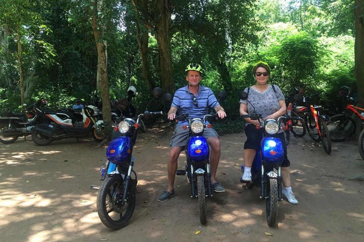 a man and woman sitting on their motorcycles